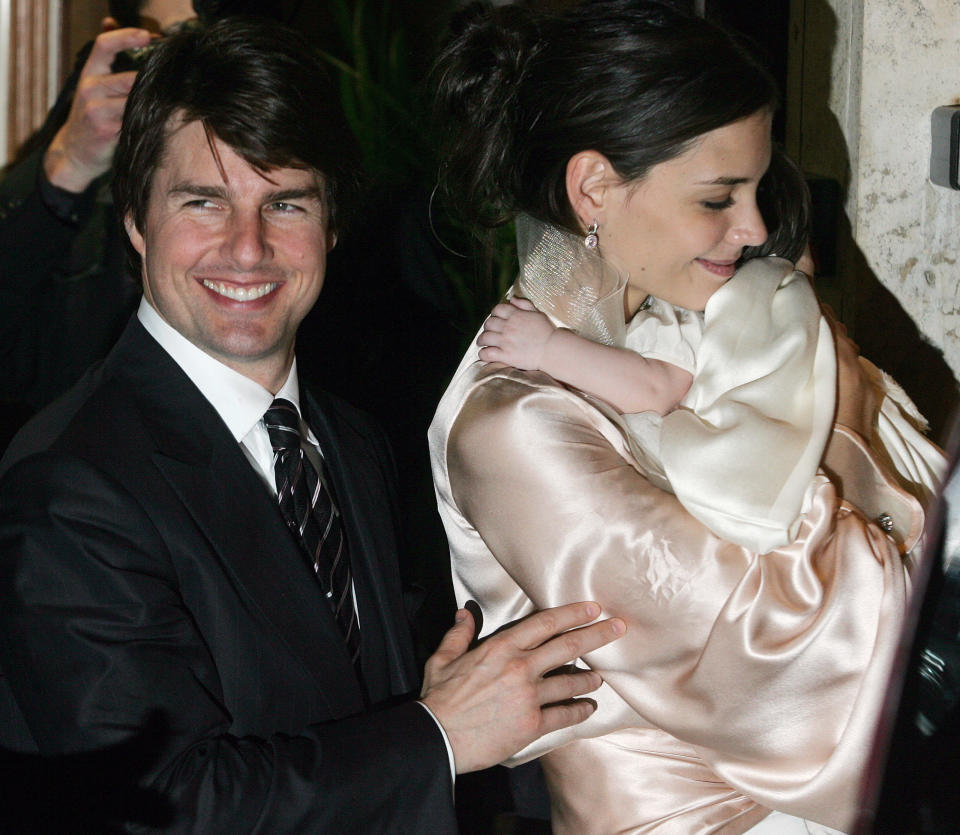Tom Cruise and Katie Holmes, who is holding baby Suri. 