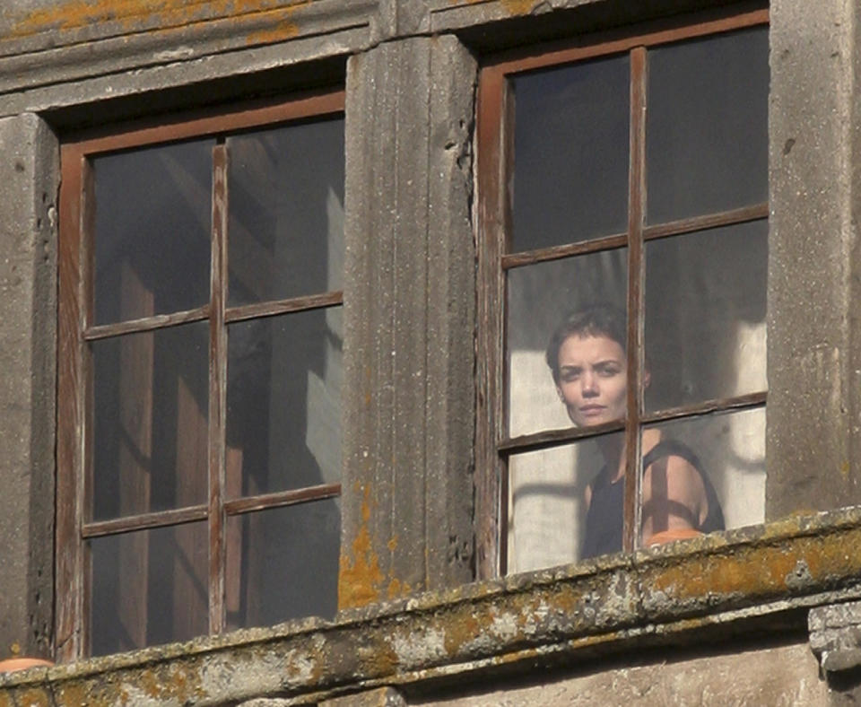Actress Katie Holmes can be seen looking out a window of the castle where she and Tom Cruise got married.