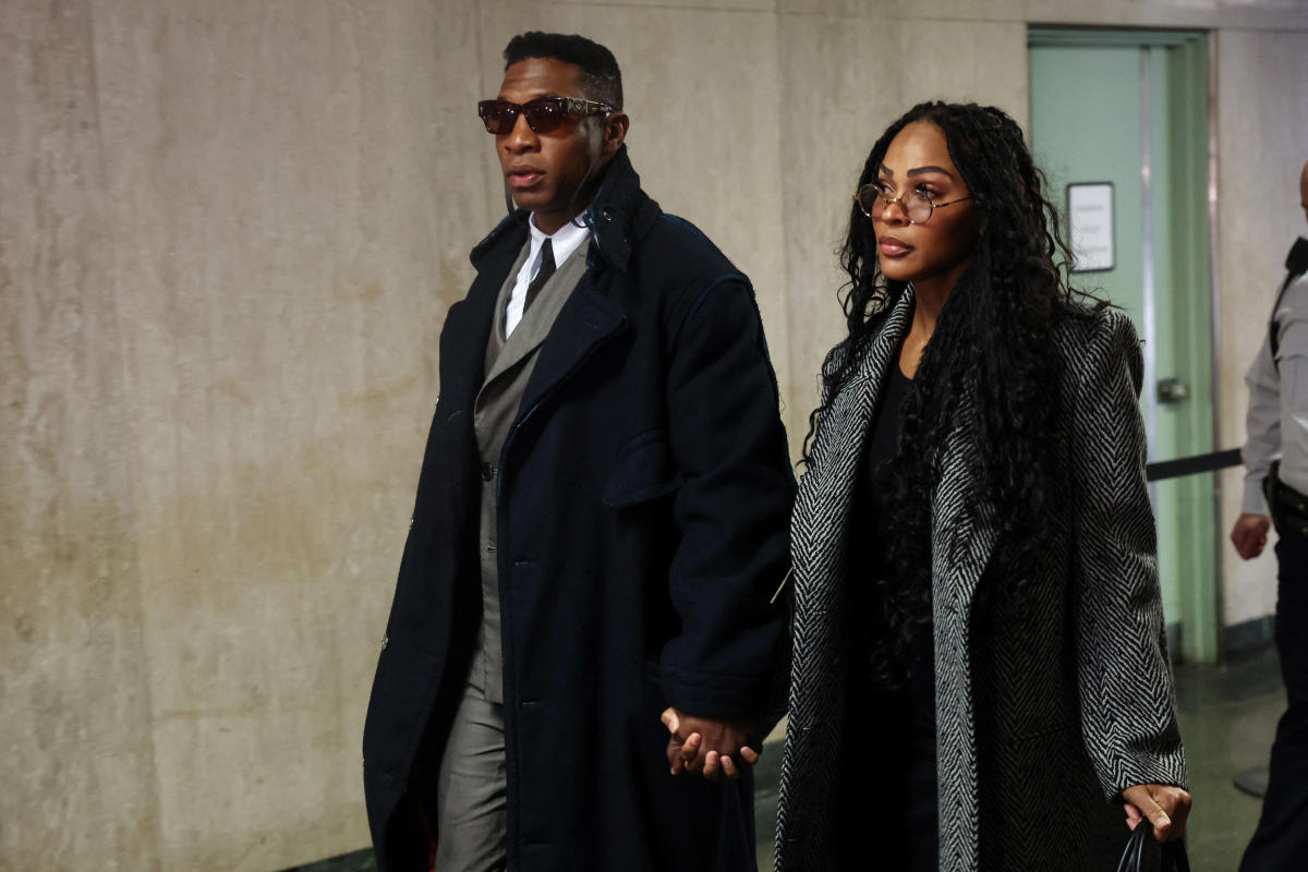 Jonathan Majors arrives for domestic violence trial with Meagan Good at his side and a Bible in hand. 'That is not by mistake,' says legal expert.